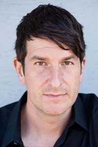 Joe Cobden as News Correspondent (Brian Galloway) in Beau Is Afraid (04/2023)