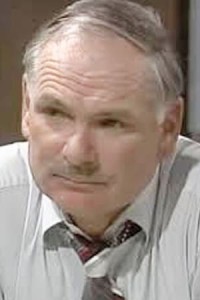 Clive Hearne as Tow Truck Driver in Diner in Mad Max (04/1979)