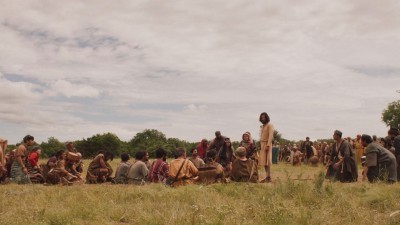Jesus with kneeling crowd