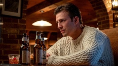 cozy cable-knit sweater like Chris Evans’ character Ransom Drysdale wore
