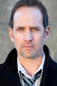 Robert Moloney as News Show Host in Man of Steel (06/2013)