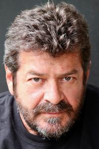 Jay Amor as Gatman (uncredited) in Looper (09/2012)