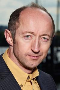 Tom Bonington as Priest in Maleficent: Mistress of Evil (10/2019)