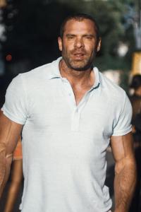 Adam Basil as Large GMS in The Old Guard (07/2020)