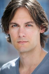 Robert Beitzel as Lewis the Director in Babylon (12/2022)