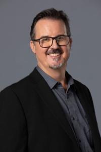 Jake Aust as Executive Producer in The Gray Man (07/2022)