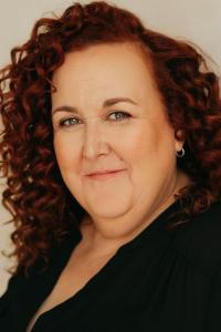 Sharron Matthews as Joan the Secretary in Mean Girls (04/2004)