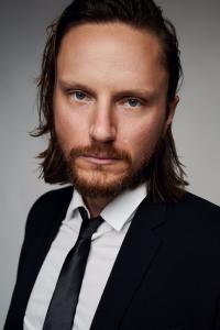 Joshua Mikel as Phil in Renfield (04/2023)