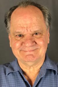 Ritchie Montgomery as Bodega Owner in Looper (09/2012)