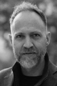 Nathan Johnson as Original Music Composer in Looper (09/2012)