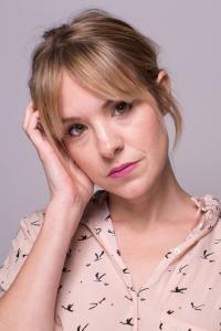 Brea Grant as TK Billboard Girl (uncredited) in Looper (09/2012)