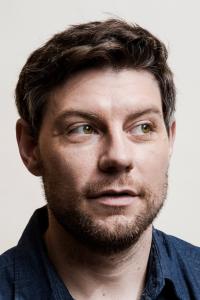 Patrick Fugit as Officer Elwood in Babylon (12/2022)