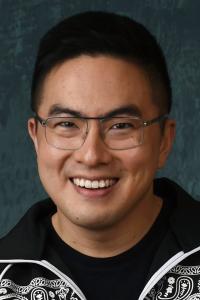Bowen Yang as Ray the Moderator in The Lost City (03/2022)