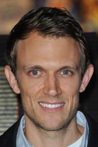 Matt Bettinelli-Olpin as Party Guest (voice) (uncredited) in Scream (01/2022)