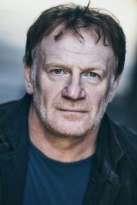 Mark Lewis Jones as Thomas 'Tom' Christie in Book Six (03/2022)