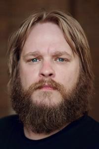 Jeppe Beck Laursen as Father Beck in What Happened to Monday (08/2017)