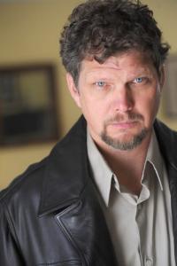 Clay Wilcox as AA Chairperson in Father Stu (04/2022)